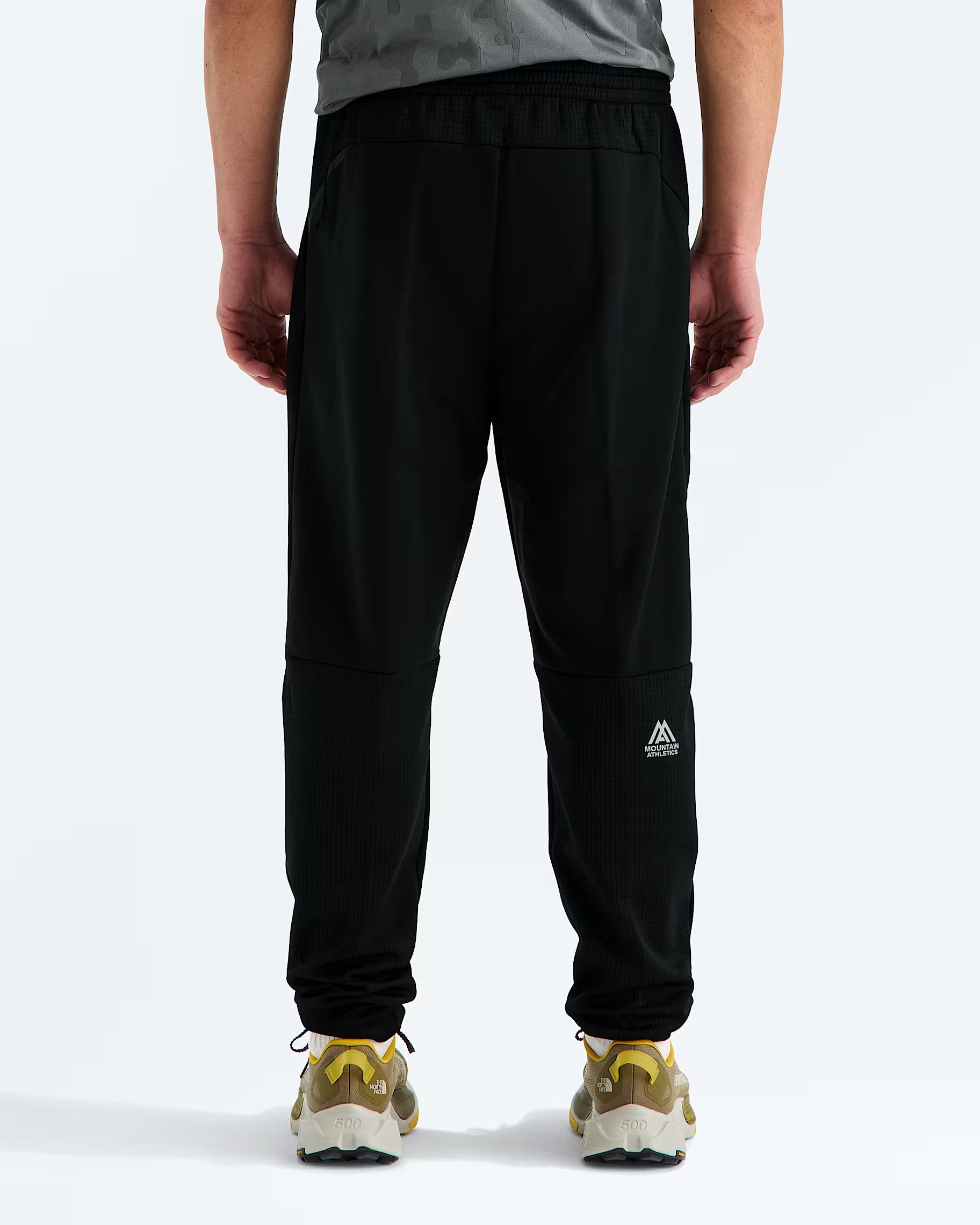 Mens-Mountain-Athletics-Fleece-Pants-20-TNF-BACK_497baace-4ece-4fab-8153-bf264715cda0.avif